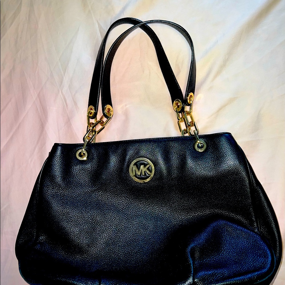 Mochael Kors soft black and gold leather purse with multiple pockets!